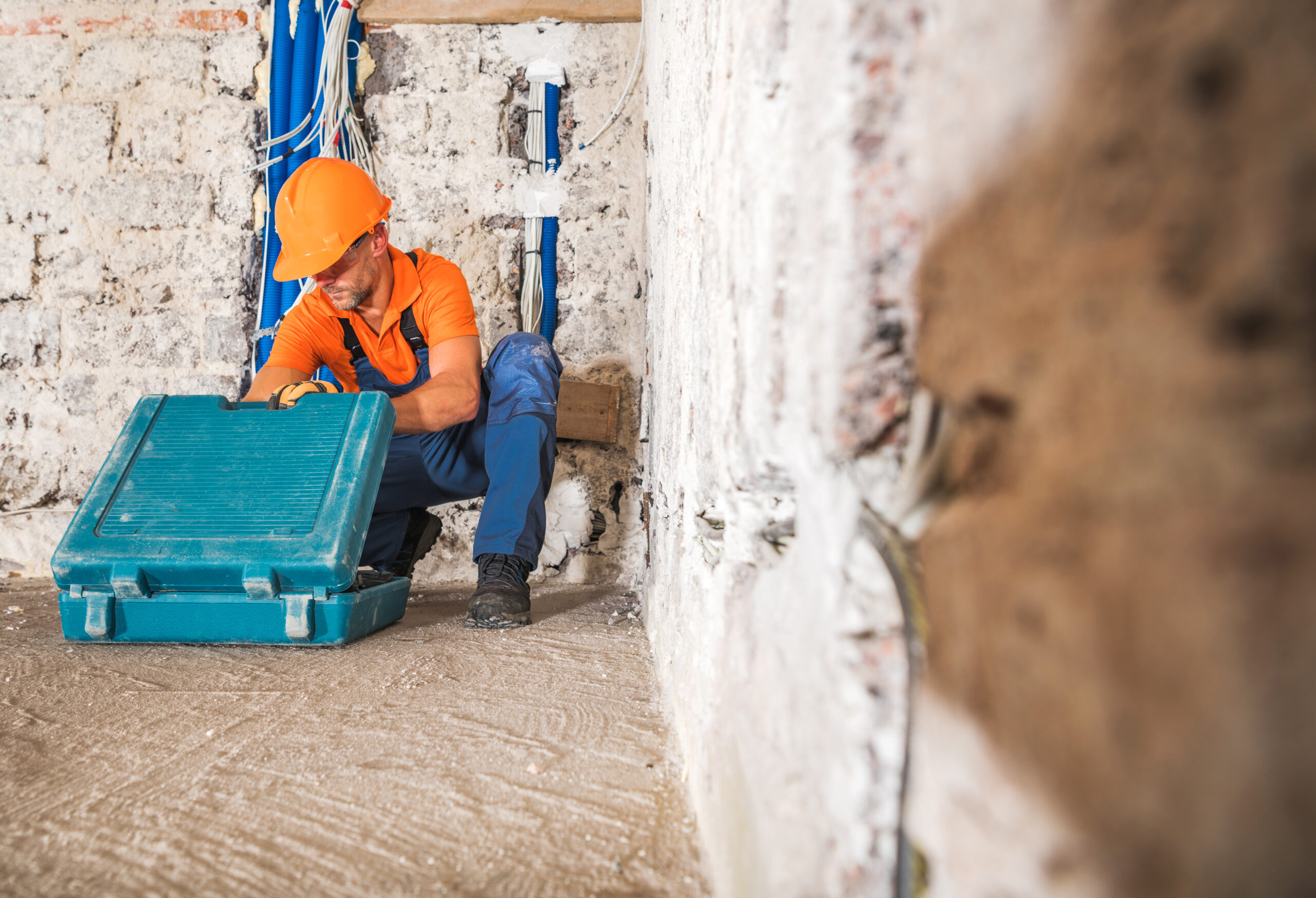 Construction Worker Inside Remodeled Concrete House Interior